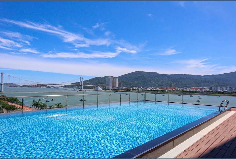 Modern 2-bedroom riverside apartment with river view and pool